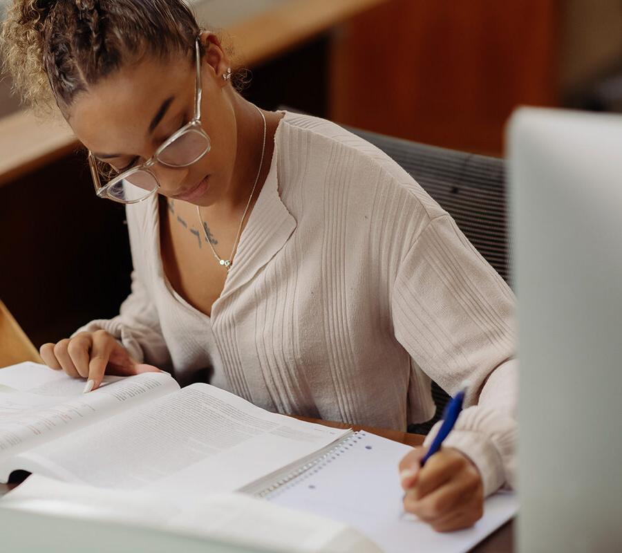 a journalism student studies for an exam